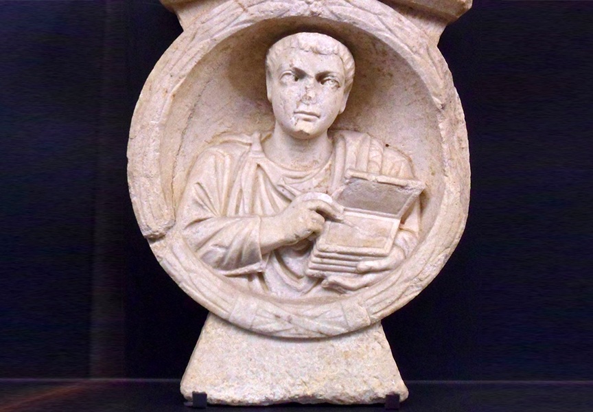 Roman scribe shown with his stylus and wax tablets on his tomb stele at Flavia Solva, Noricum.