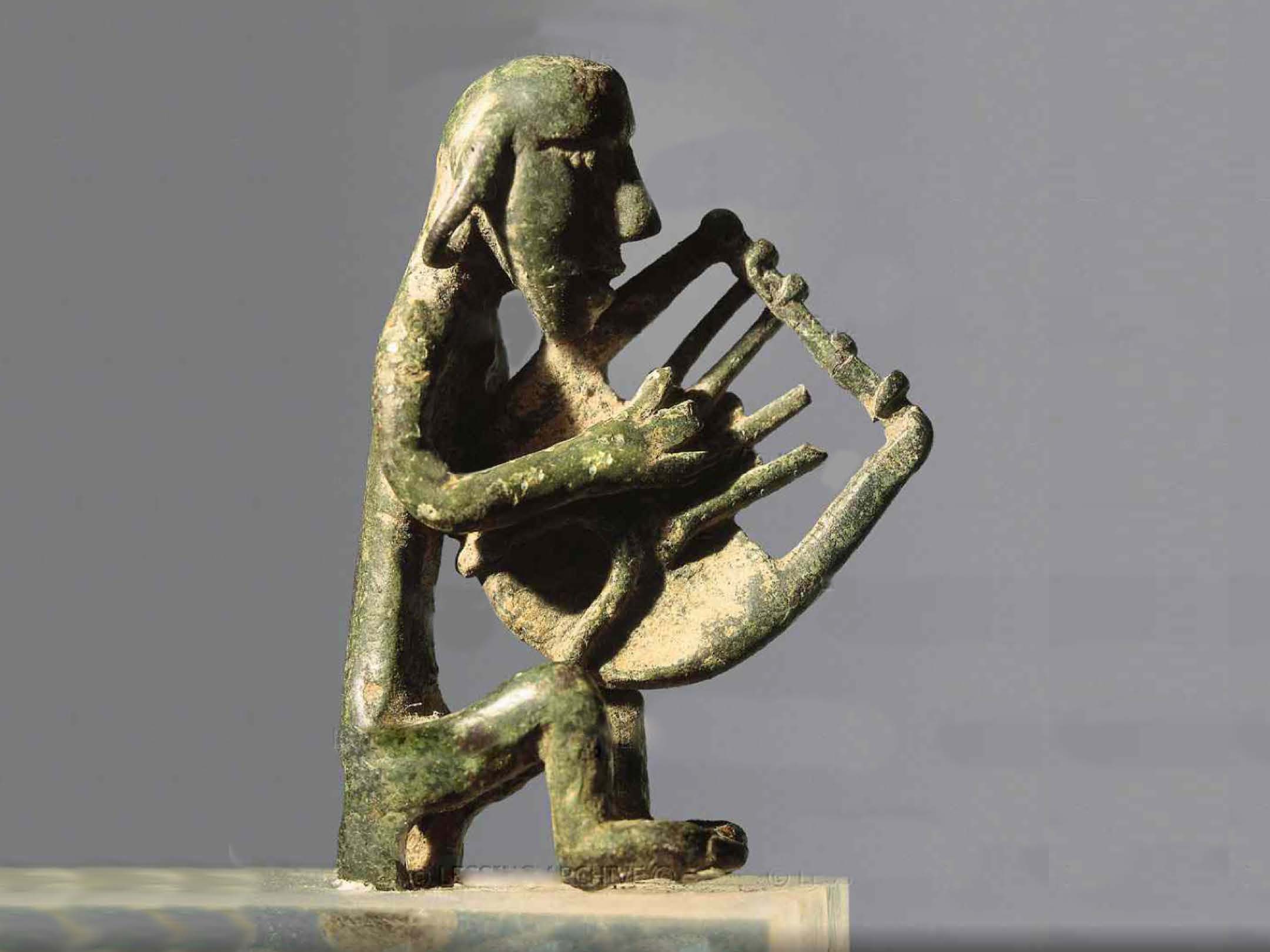 Singer with lyre. Greek bronze, geometric, 8th century BCE.